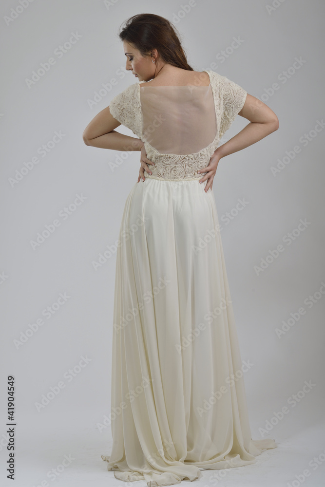 elegant woman in fashionable dress posing in the studio elegant woman in fashionable dress posing in the studio