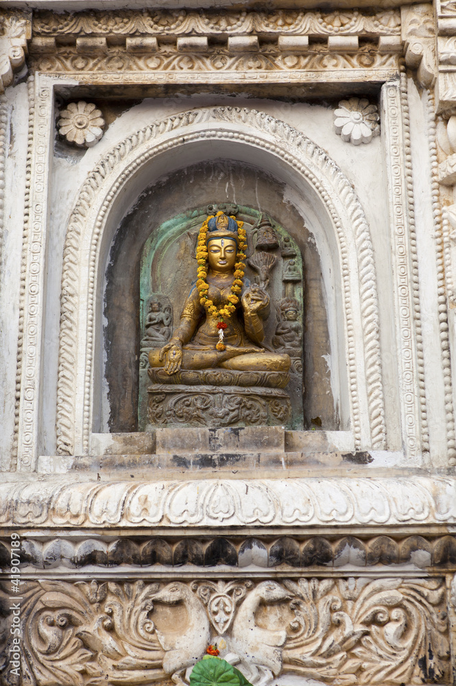 Buddha image outside Mahabodhi Temple, Bodhgaya, Bihar, India.