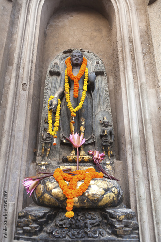 Buddha image outside Mahabodhi Temple, Bodhgaya, Bihar, India. photo