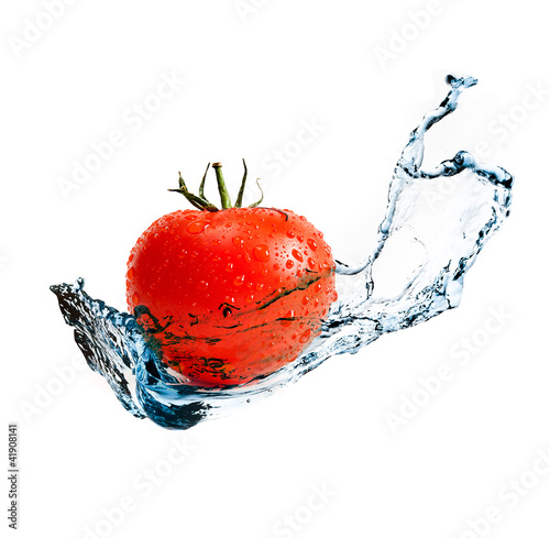 red ripe tomato with water splash