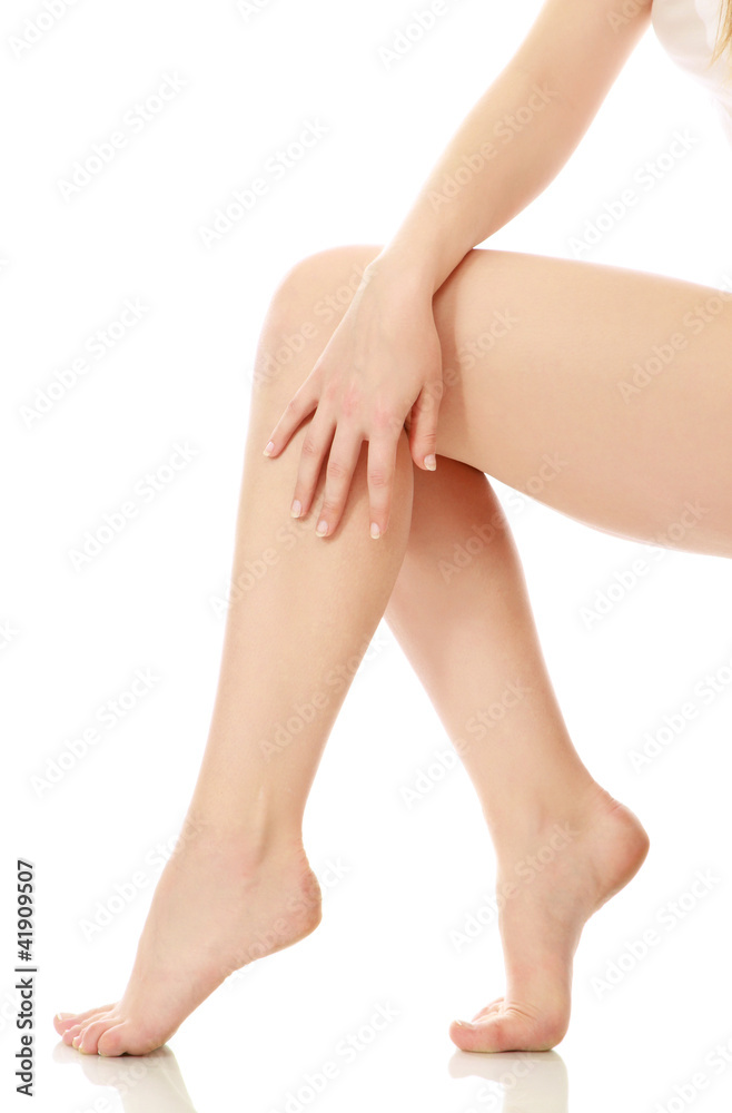 Beautiful female legs, isolated on white Beautiful female legs, isolated on white