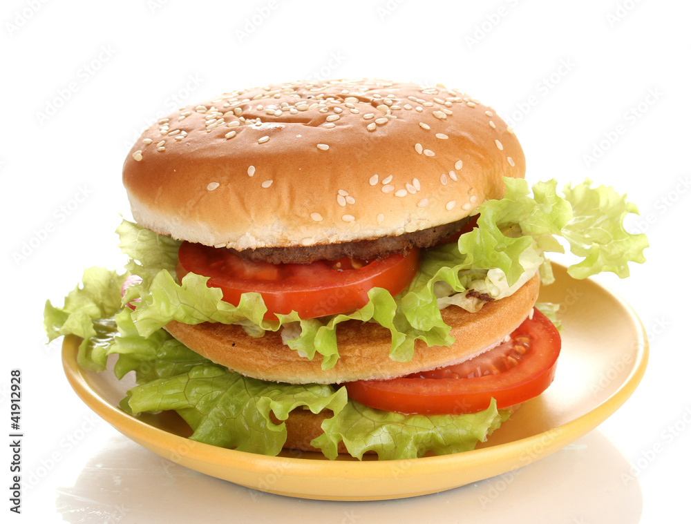 Big and tasty hamburger on plate isolated on white Big and tasty hamburger on plate isolated on white