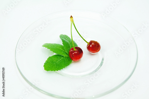 Fresh,red cherries isolated on transparent plate