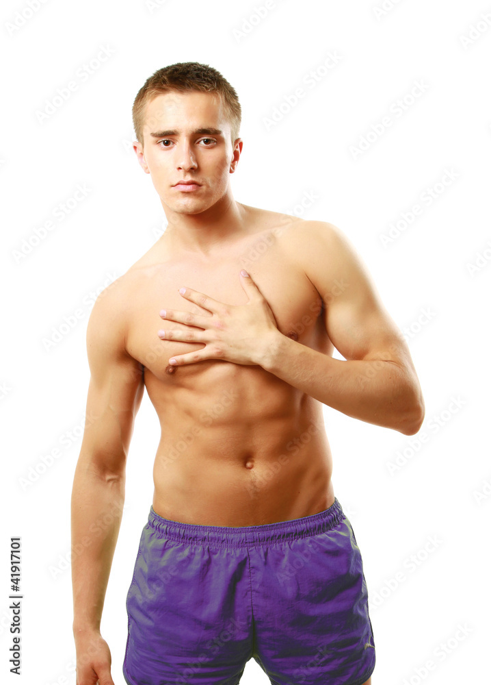A muscular man holding his chest, isolated on white