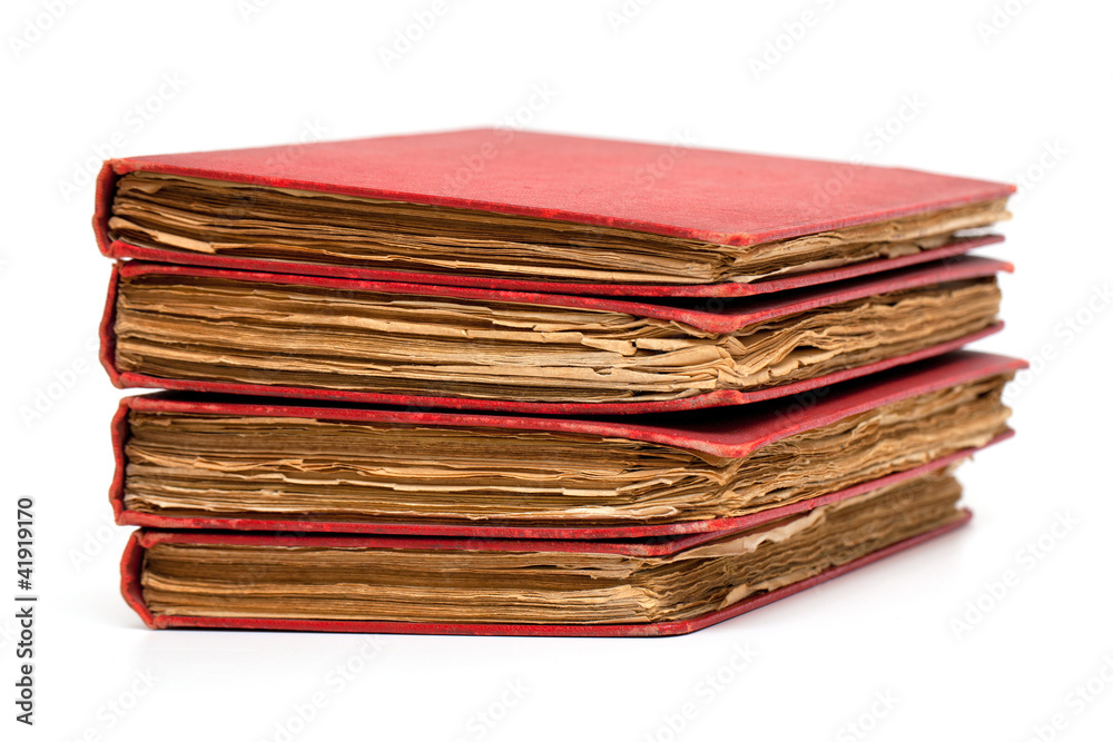 stack of old books with red covers stack of old books with red covers