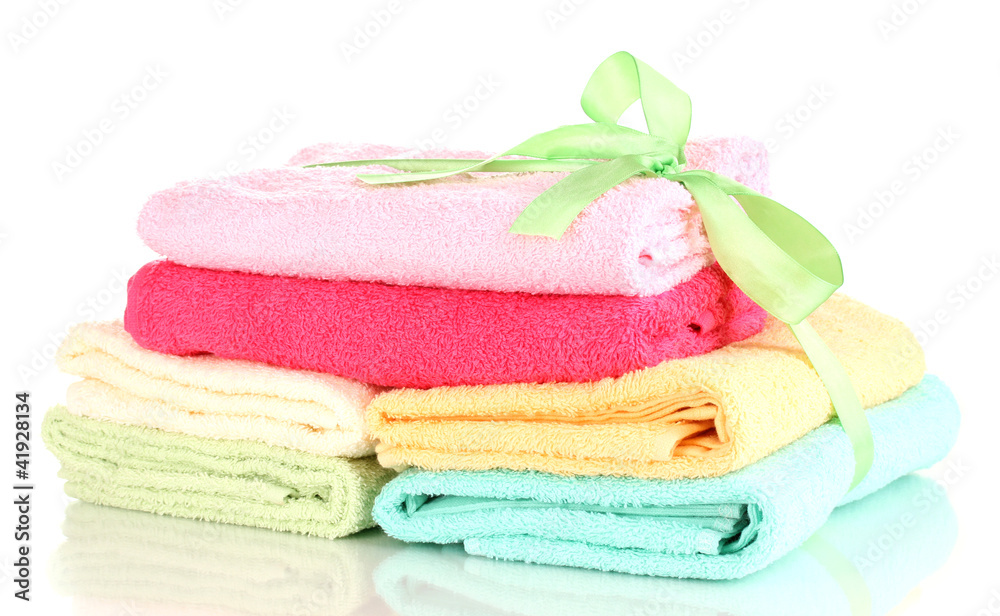 Colorful towels with ribbon isolated on white Colorful towels with ribbon isolated on white