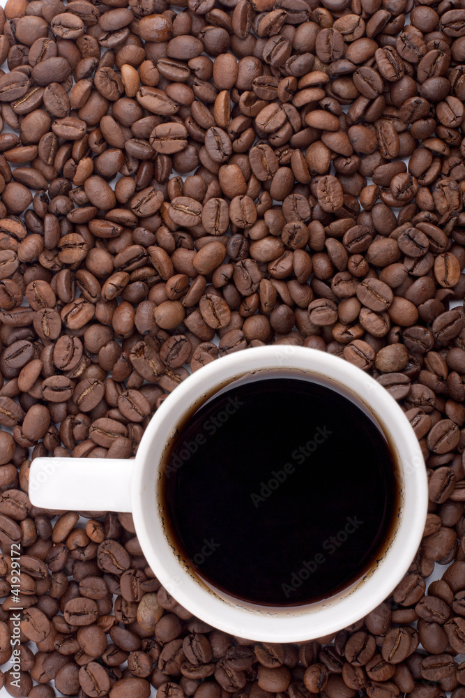 White coffee cup on coffee beans White coffee cup on coffee beans