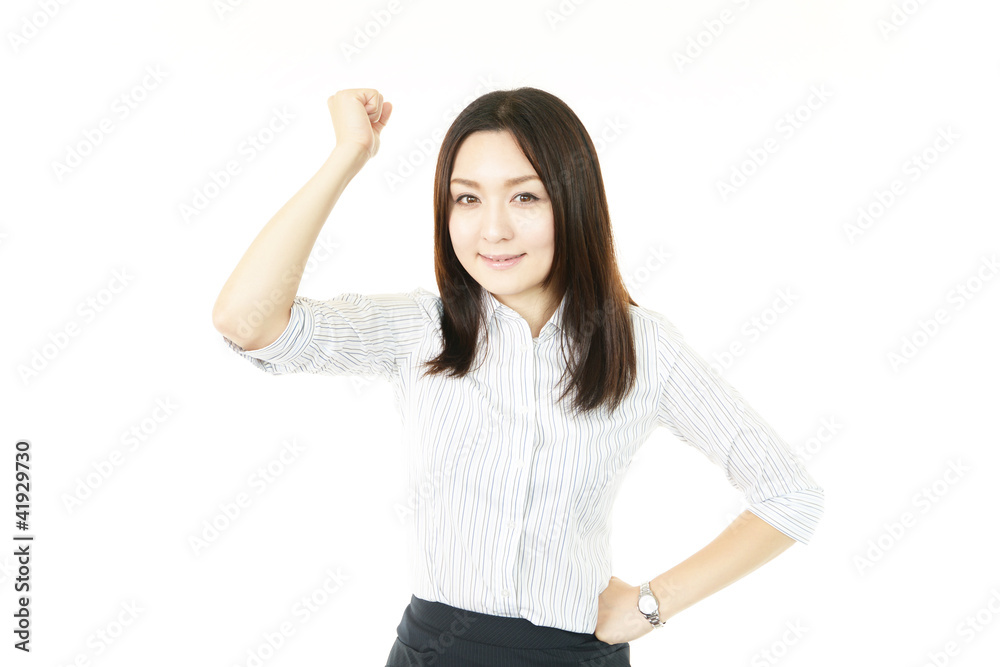 ガッツポーズをしている笑顔のオフィスレディー