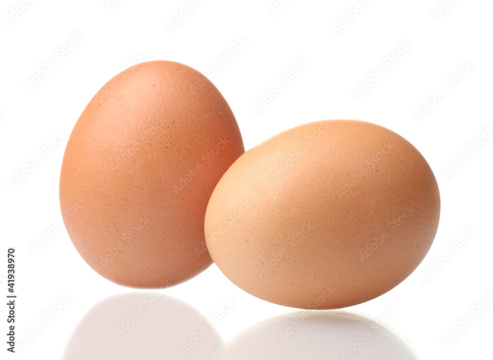 two brown eggs isolated on white two brown eggs isolated on white