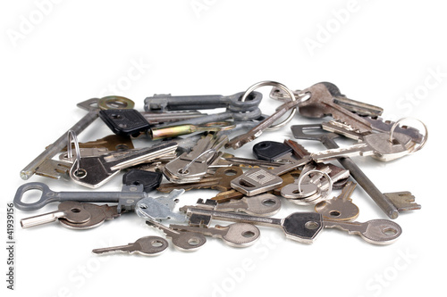 Lot of metal keys isolated on white