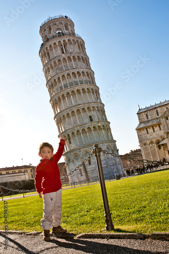 Boy sustains Pisa tower optical effect
