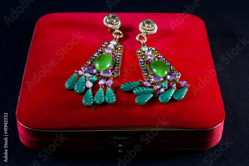 Jewelry box with precious stones earrings photo