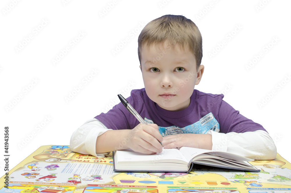 Portrait of a young schoolboy at his desk Portrait of a young schoolboy at his desk
