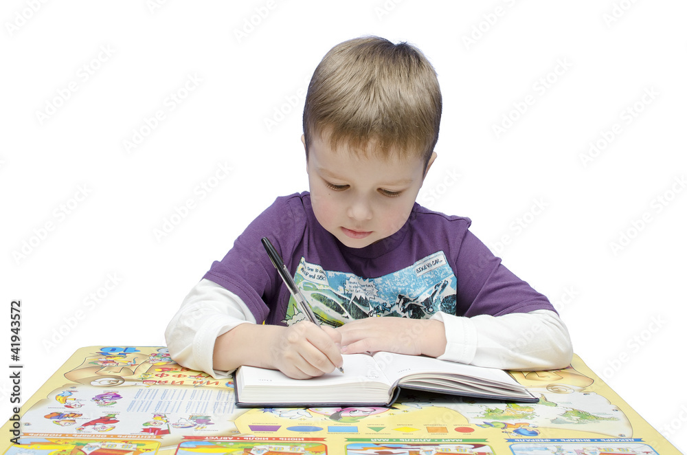Portrait of a young schoolboy at his desk Portrait of a young schoolboy at his desk