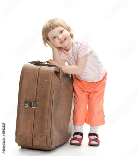 Little traveler preparing for a trip