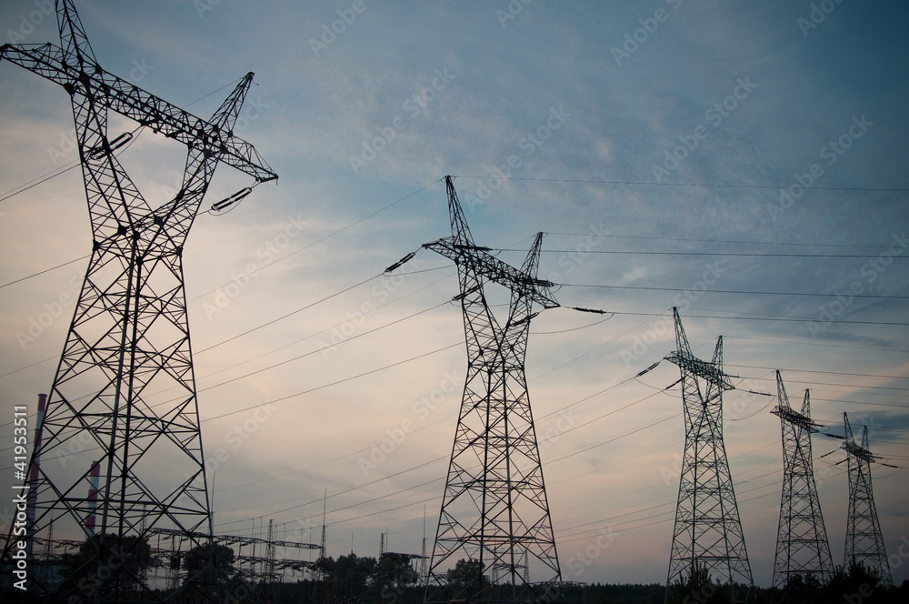 Pylon and transmission power line in sunset Pylon and transmission power line in sunset