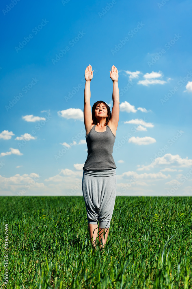 beautiful young woman relaxing at the field