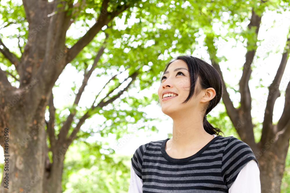 young asian woman relaxing in the forest young asian woman relaxing in the forest