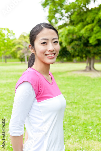 young asian woman relaxing in the park