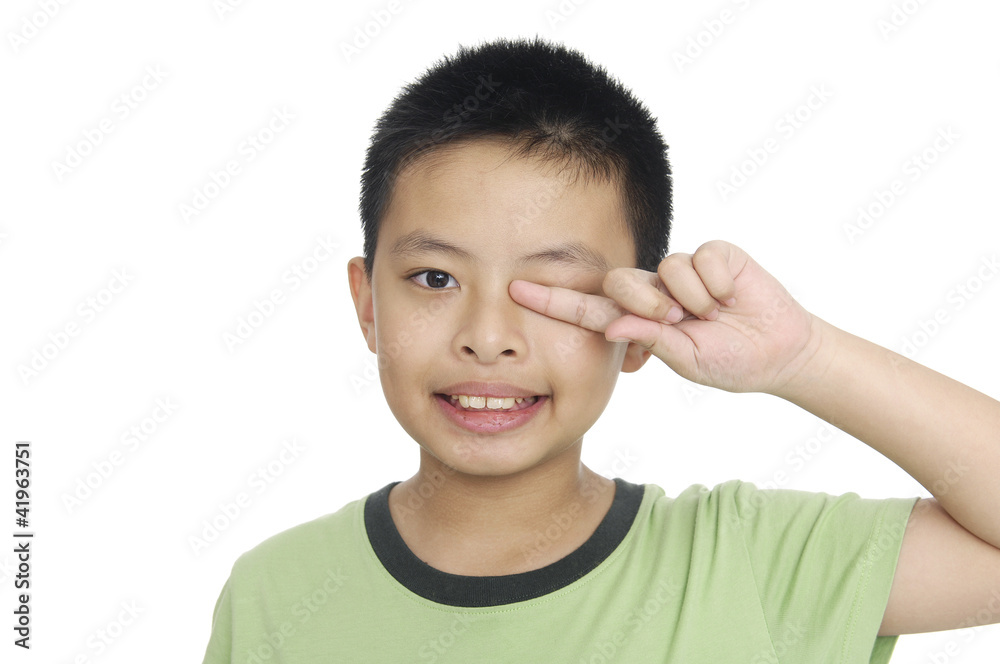 A tired little boy rubbing eyes, isolated on white A tired little boy rubbing eyes, isolated on white