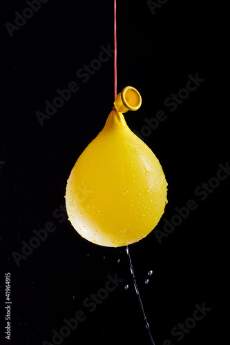 Yellow balloon with water