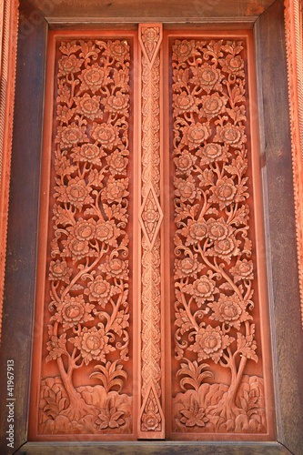 Traditional northern Thai style church door