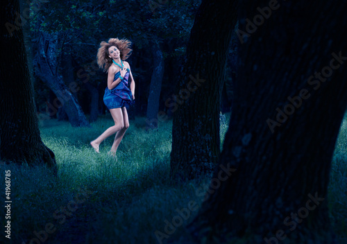 Forest fairy dancing in woods