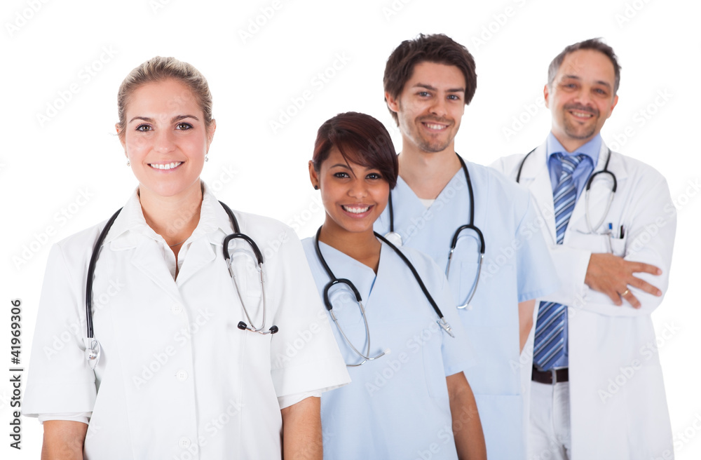 Group of doctors standing together over white