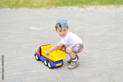 Boy with a toy car