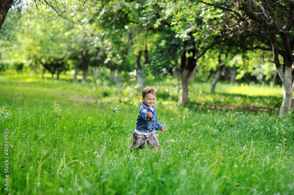 Adorable little boy having fun in a park Adorable little boy having fun in a park