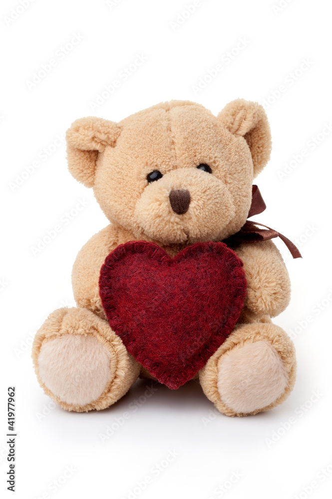 Obraz premium Teddy bear holding red heart