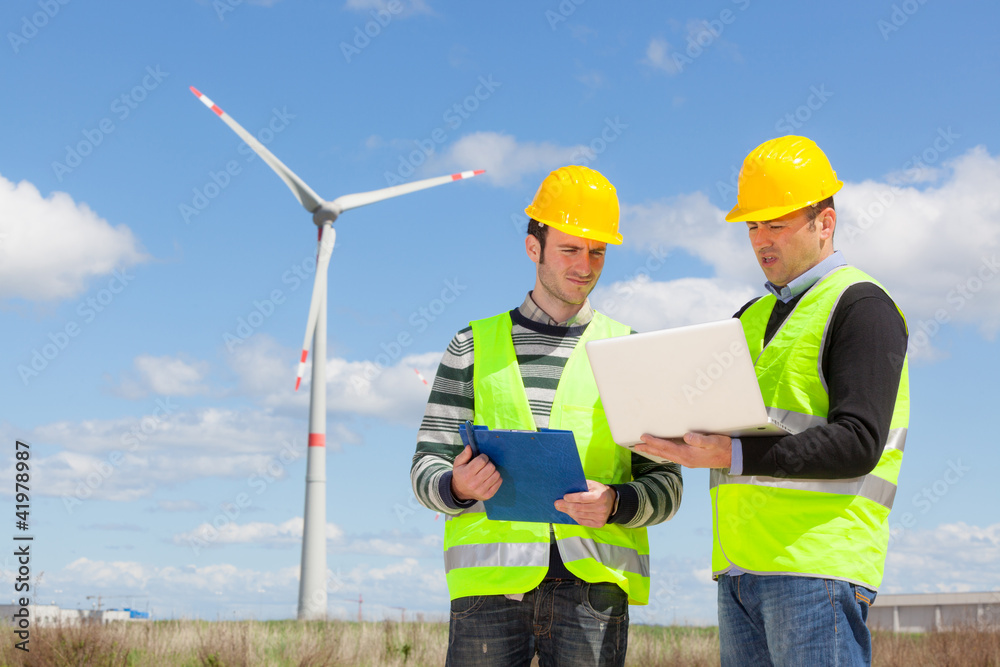 Two Engineers in a Wind Turbine Power Station Two Engineers in a Wind Turbine Power Station