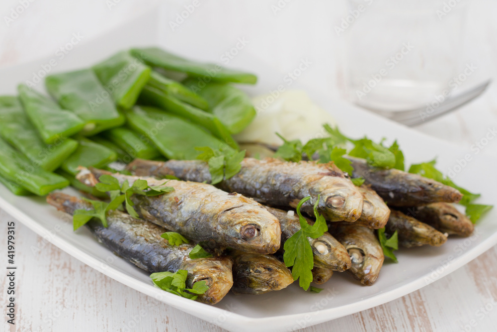 fried sardines with boiled green beans and onion fried sardines with boiled green beans and onion