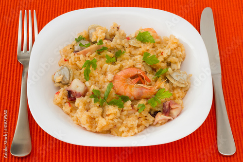 rice with seafood in the white plate