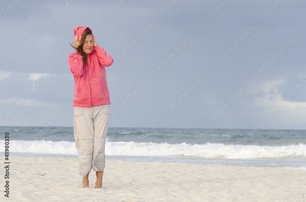Woman at beach in autumn weather