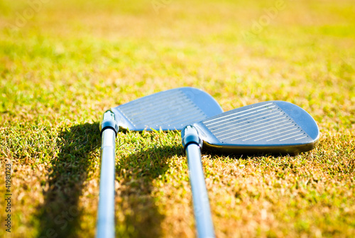 golf clubs on grass