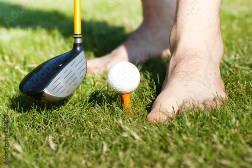 playing golf barefoot