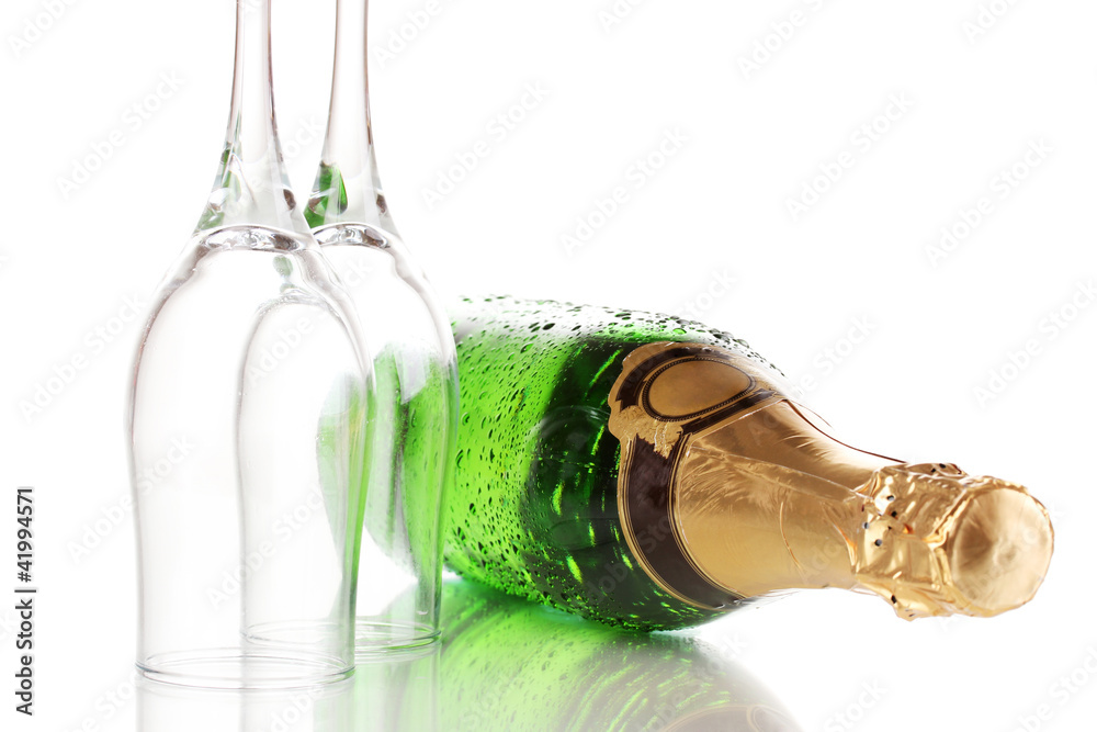 Fototapeta premium Bottle of champagne and goblets isolated on white