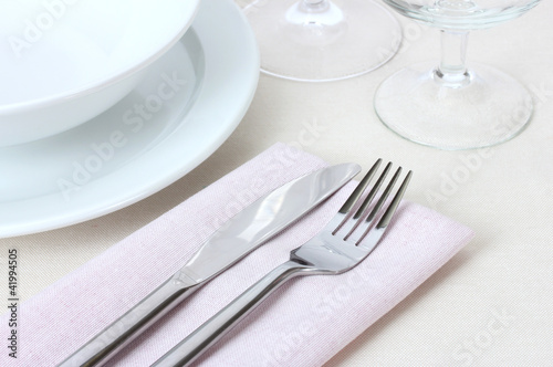 Table setting with fork  knife  plates and napkin