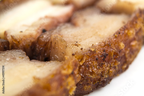 Siu Yuk - Chinese crispy roasted pork belly. Close up. photo