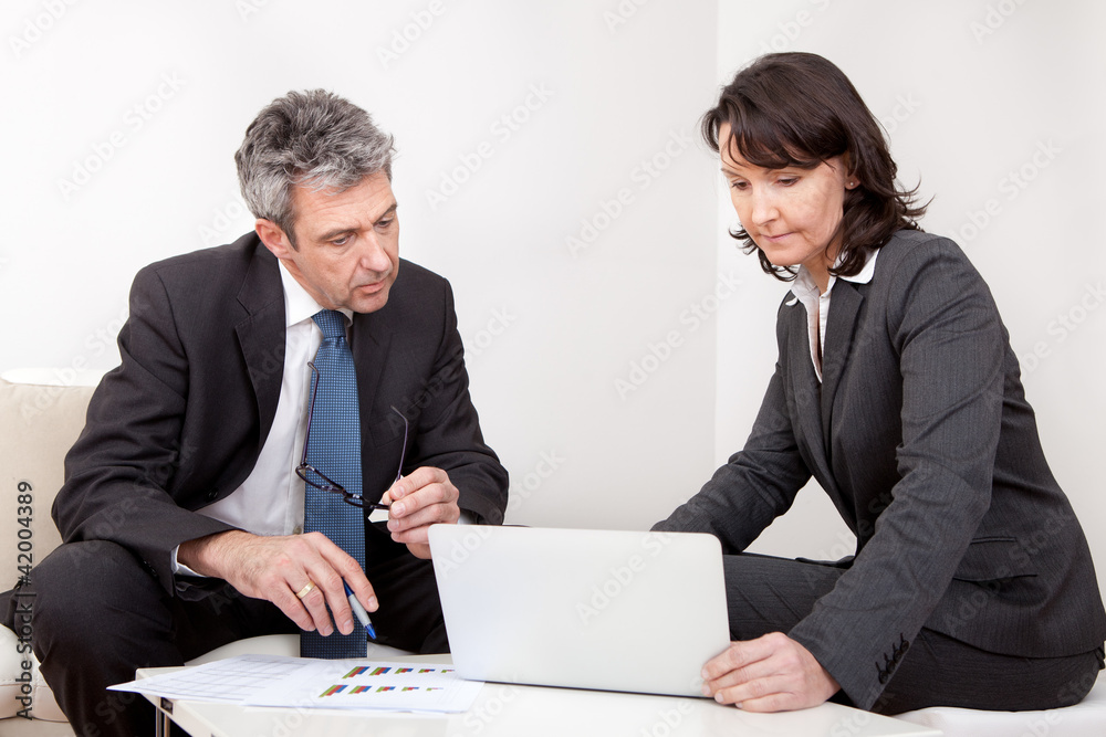 Two business people at the meeting Two business people at the meeting