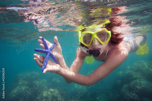 Woman holding starfish