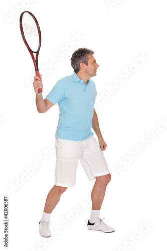 Mature man playing tennis © Andrey Popov