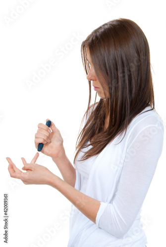 Woman with Diabetes lancet in hand prick finger