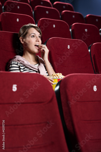 Young woman in the cinema hall