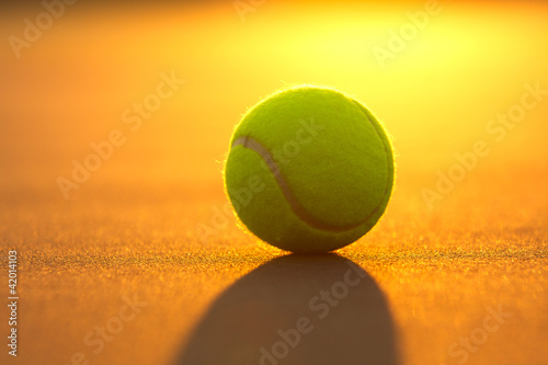 Tennis Ball on the Court at Sunset © 33ft