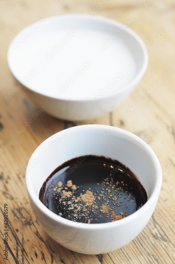 Hot chocolate with spice and milk in white cups Hot chocolate with spice and milk in white cups
