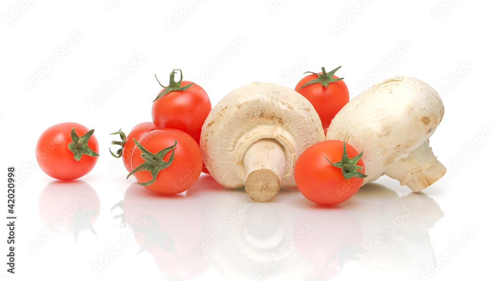 cherry tomatoes and mushrooms on a white background cherry tomatoes and mushrooms on a white background