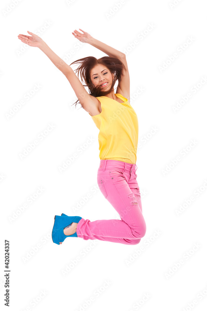 casual young excited woman  jumping in air