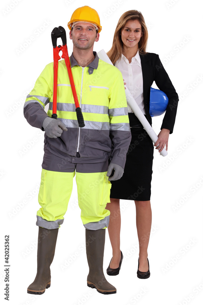 craftsman and businesswoman posing together craftsman and businesswoman posing together
